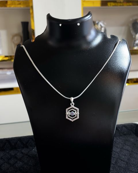 Pendant with a hexagon design on a fine chain