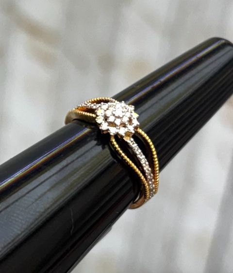 Diamond ring with a round cluster of diamonds, close-up